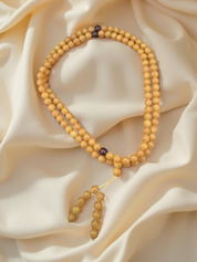 Mala aus Kunst-Bernstein im tibetischen Stil mit 108 Perlen, ideal für Meditation und Yoga.